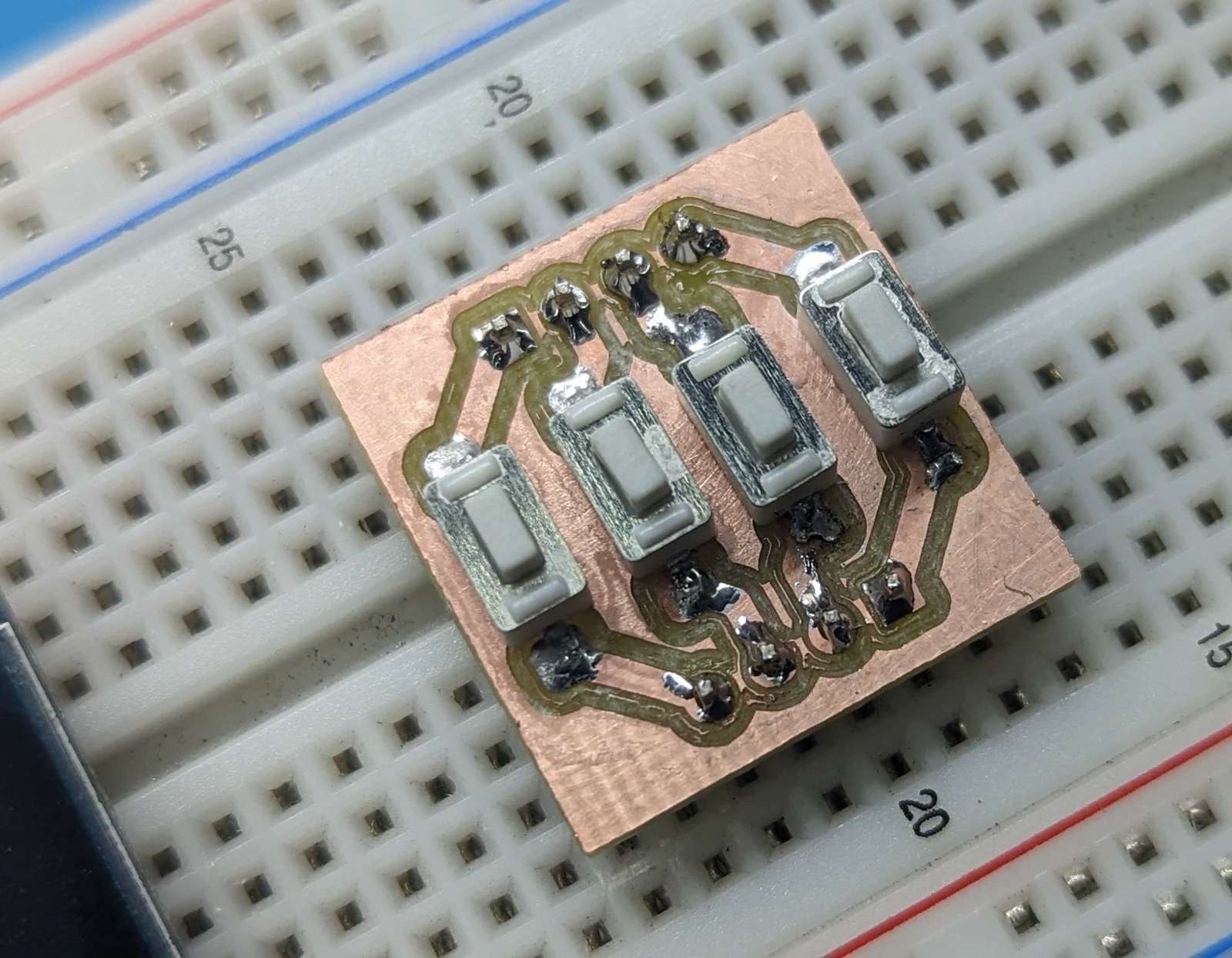 mattwach's finished small CNC-milled copper circuit board with soldered pushbuttons