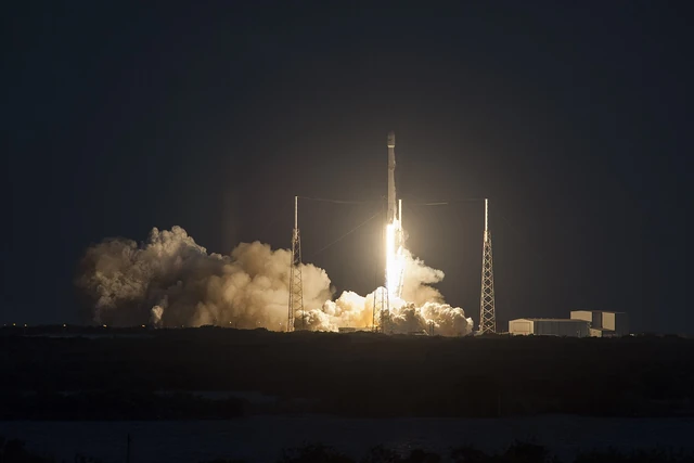 A Falcon 9 rises on a brilliant column of exhaust during the archival SES-9 nighttime launch in March 2016
