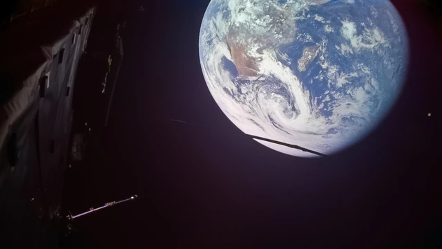 Juice's actual Earth flyby image shows the curved planet and bright cloud systems during its September 2026 encounter