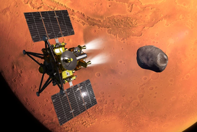 JAXA's artist concept places MMX near Mars with Phobos in the background. It illustrates the mission plan rather than a completed arrival.