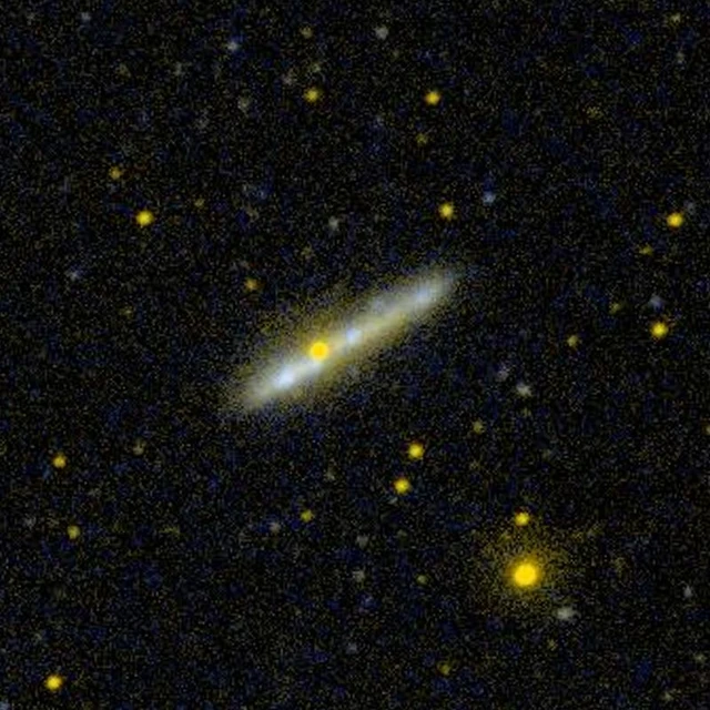 An older GALEX ultraviolet view shows NGC 1827 in another wavelength range and at a different scale. It is not an earlier version of the new Hubble exposure.